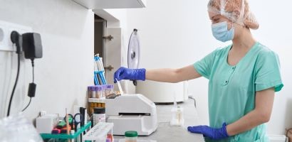 doctor in medical suit working in laboratory 410 200